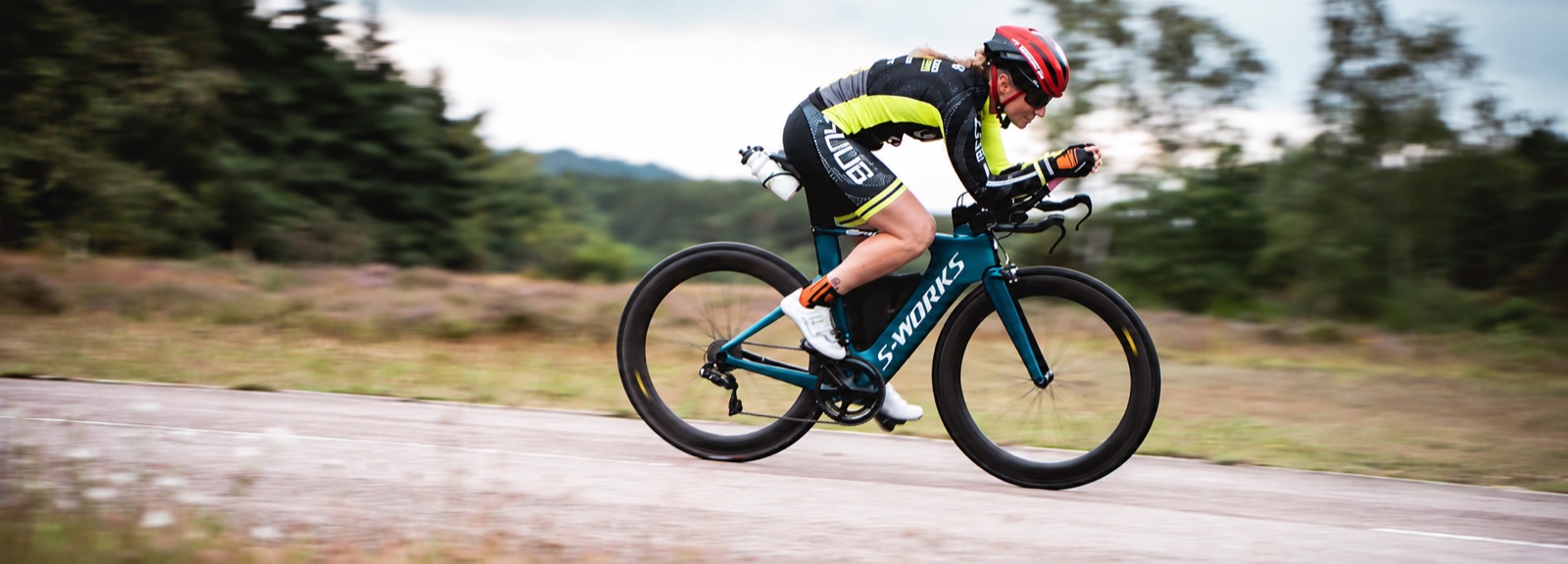 Triathlete riding a time-trial bike
